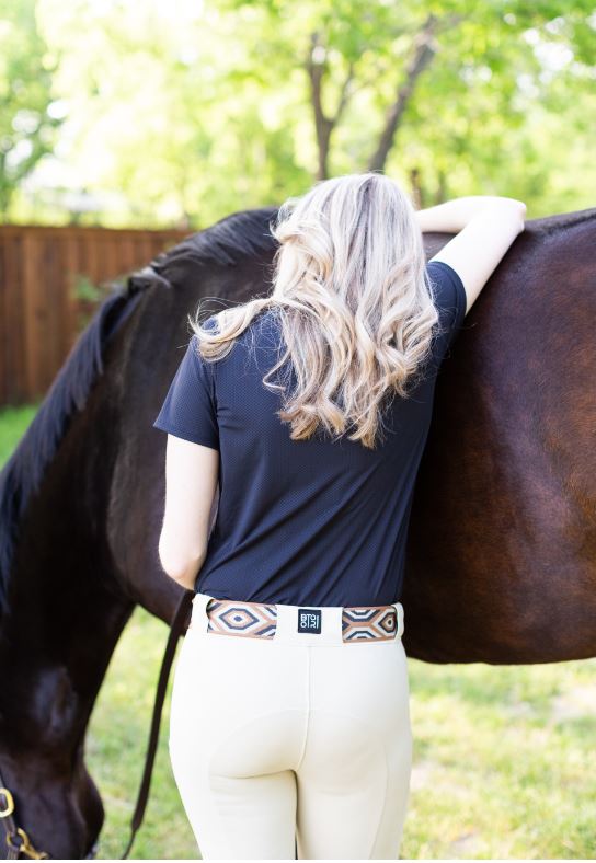 Kelly with horse wearing wearing BOTORI riding apparel